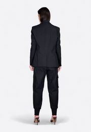 Back view of model wearing wool zipper blazer, East Vibe